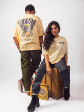 Male and female model wearing gangsta beige oversized graphic t shirt,male model showing back view while female model showing front view while sitting Attire Essentials