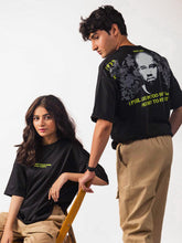 Male and female model wearing black kanye west oversized graphic t shirt, male model showing the back view while female model showing the front view Attire Essentials