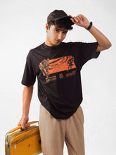 male model wearing black naruto awakening oversized graphic t shirt showing front side of the t shirt