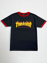 Black thrasher oversized graphic t-shirt with red trim and yellow 'Thrasher' logo on a white background