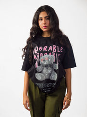 Female model wearing black oversized graphic t shirt showing front Attire Essentials