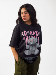 Female model wearing black oversized graphic t shirt showing right side view Attire Essentials