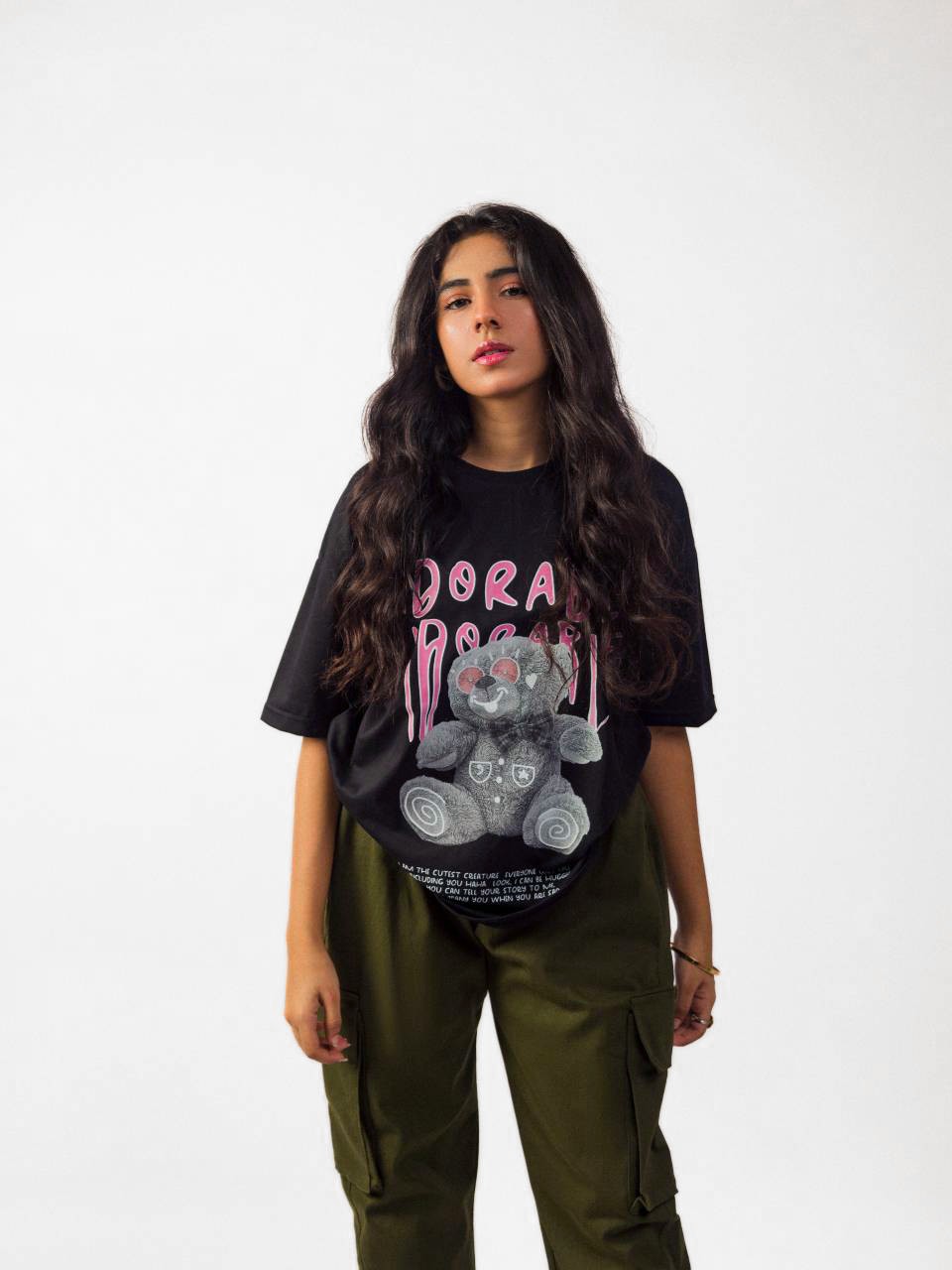 Female model wearing black oversized graphic t shirt showing front with full view Attire Essentials