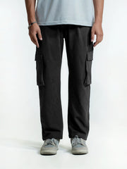 Person wearing black cargo trouser on a white background