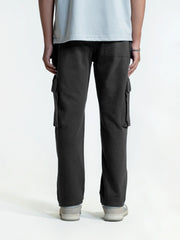 Person wearing black cargo trouser on a white background