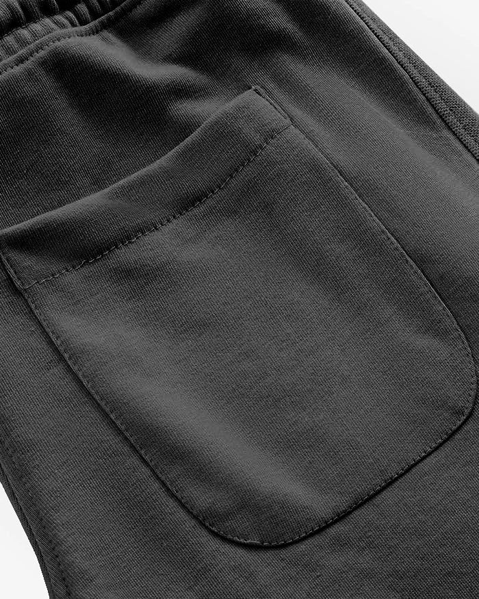 Close-up of a black pocket on a black straight pleated trouser