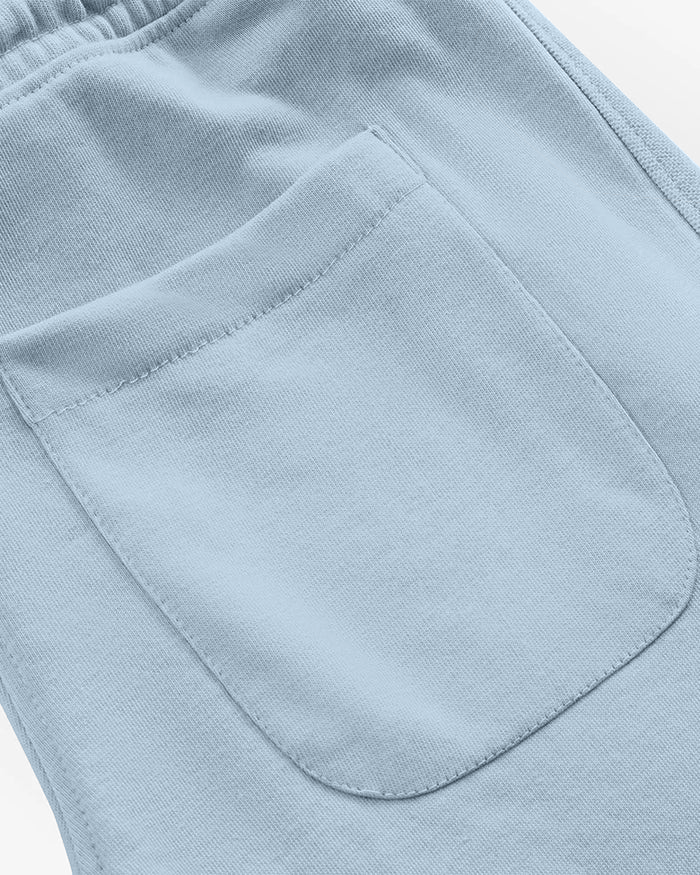 Close-up of light blue trouser with a pocket