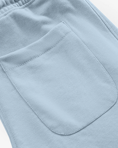 Close-up of light blue trouser with a pocket