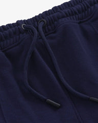 Close-up of navy blue trouser with drawstring
