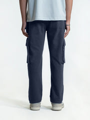 Person wearing navy cargo trouser on a white background
