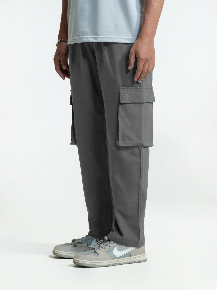Person wearing gray cargo trouser on a white background