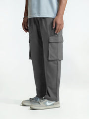 Person wearing gray cargo trouser on a white background