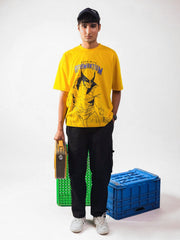 male model wearing yellow wolverine oversized graphic t shirt showing the front of the t shirt 
