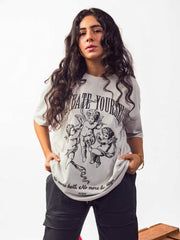 Female model wearing grey dedicate yourself oversized graphic t shirt showing front view while standing Attire Essentials