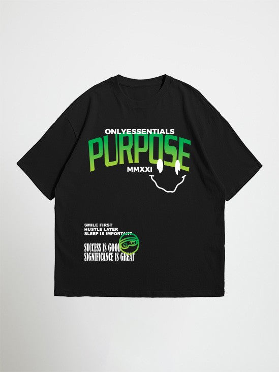 Black essentials purpose oversized graphic t-shirt with green and white text and graphics on a white background