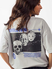female model wearing grey evolution oversized graphic t shirt showing back of the t shirt in a detailed view