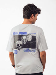 male model wearing grey evolution oversized graphic t shirt showing back of the t shirt