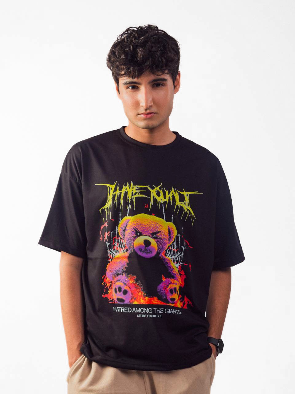 male model wearing black hate you all oversized graphic t shirt showing the front of the t shirt
