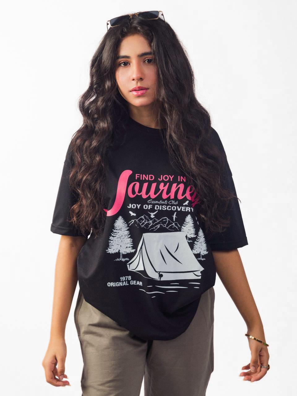 female model wearing black joy in the journey oversized graphic t shirt showing the front side of the t shirt