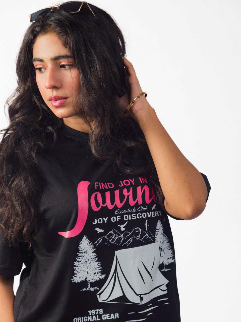 female model wearing black joy in the journey oversized graphic t shirt showing the detailed view of the front side