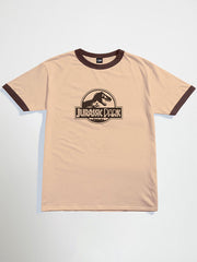 Beige Jurassic park oversized graphic t-shirt with brown ringer design featuring 'Jurassic Park' logo on a light gray background