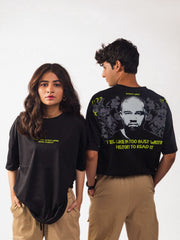 Male and female model wearing black kanye west oversized graphic t shirt, male model showing the back view while female model showing the front view both are showing in standing position Attire Essentials