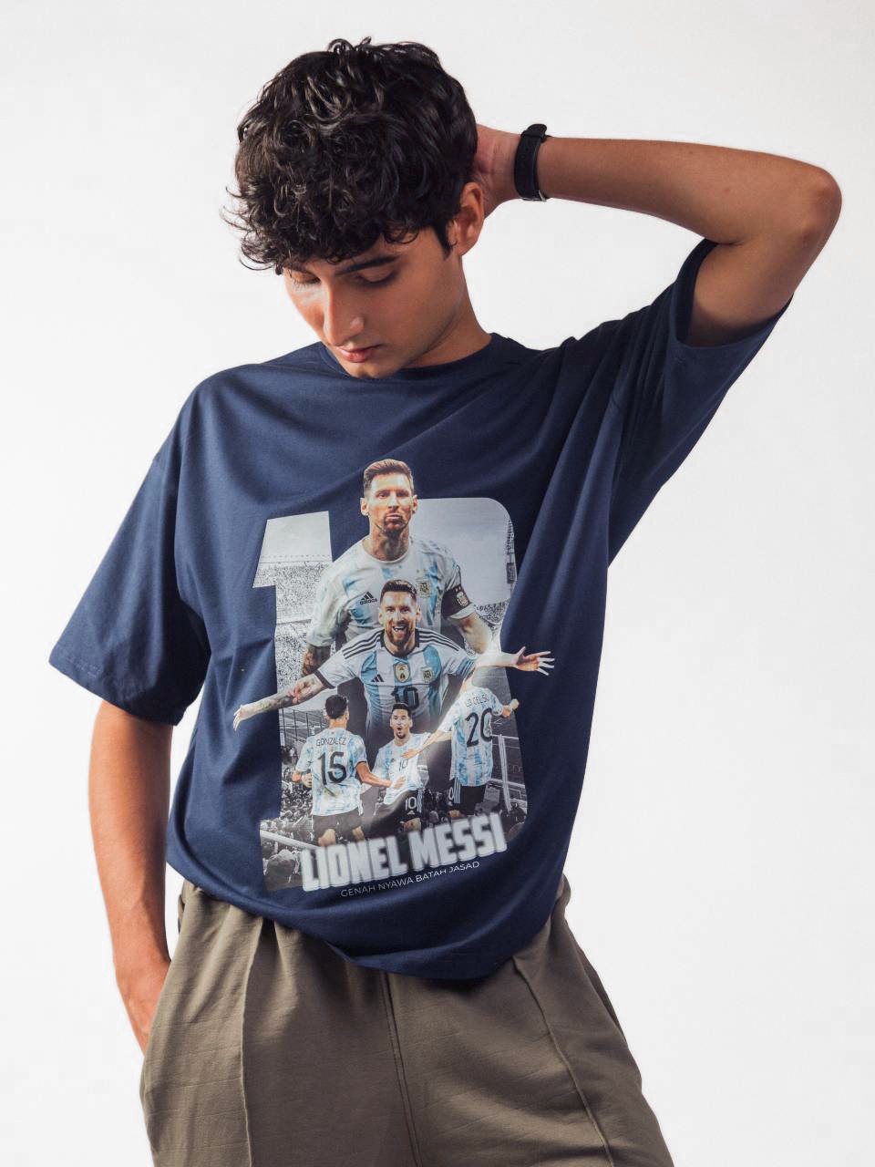 Male model wearing blue lionel messi oversized graphic t shirt showing the front view