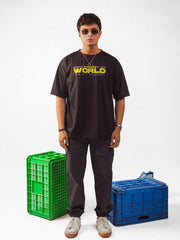 Male model wearing black loading new world oversized graphic t shirt in which male model showing the front view of the t shirt