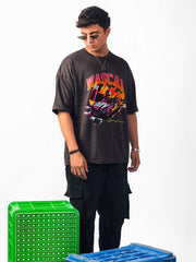 Male model wearing charcoal nascar oversized graphic t shirt showing the right front side view