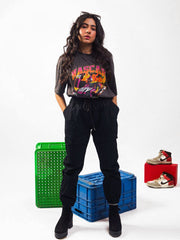 Female model wearing charcoal nascar oversized graphic t shirt showing the front view