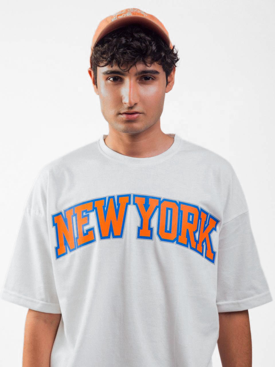 male model wearing white newyork oversized graphic t shirt showing front side detail