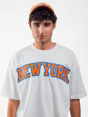 male model wearing white newyork oversized graphic t shirt showing front side detail