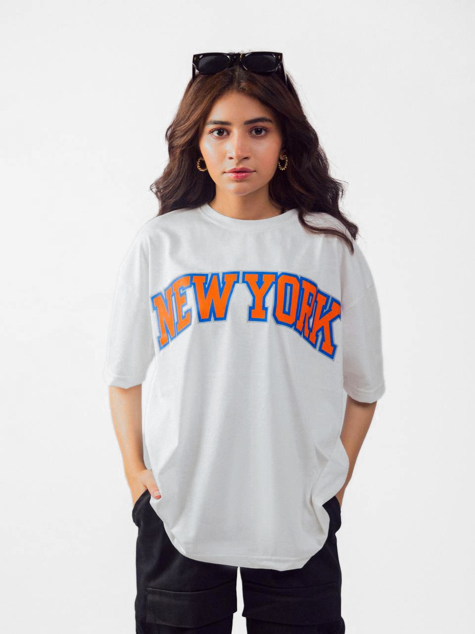 female model wearing white newyork oversized graphic t shirt showing front of the t shirt