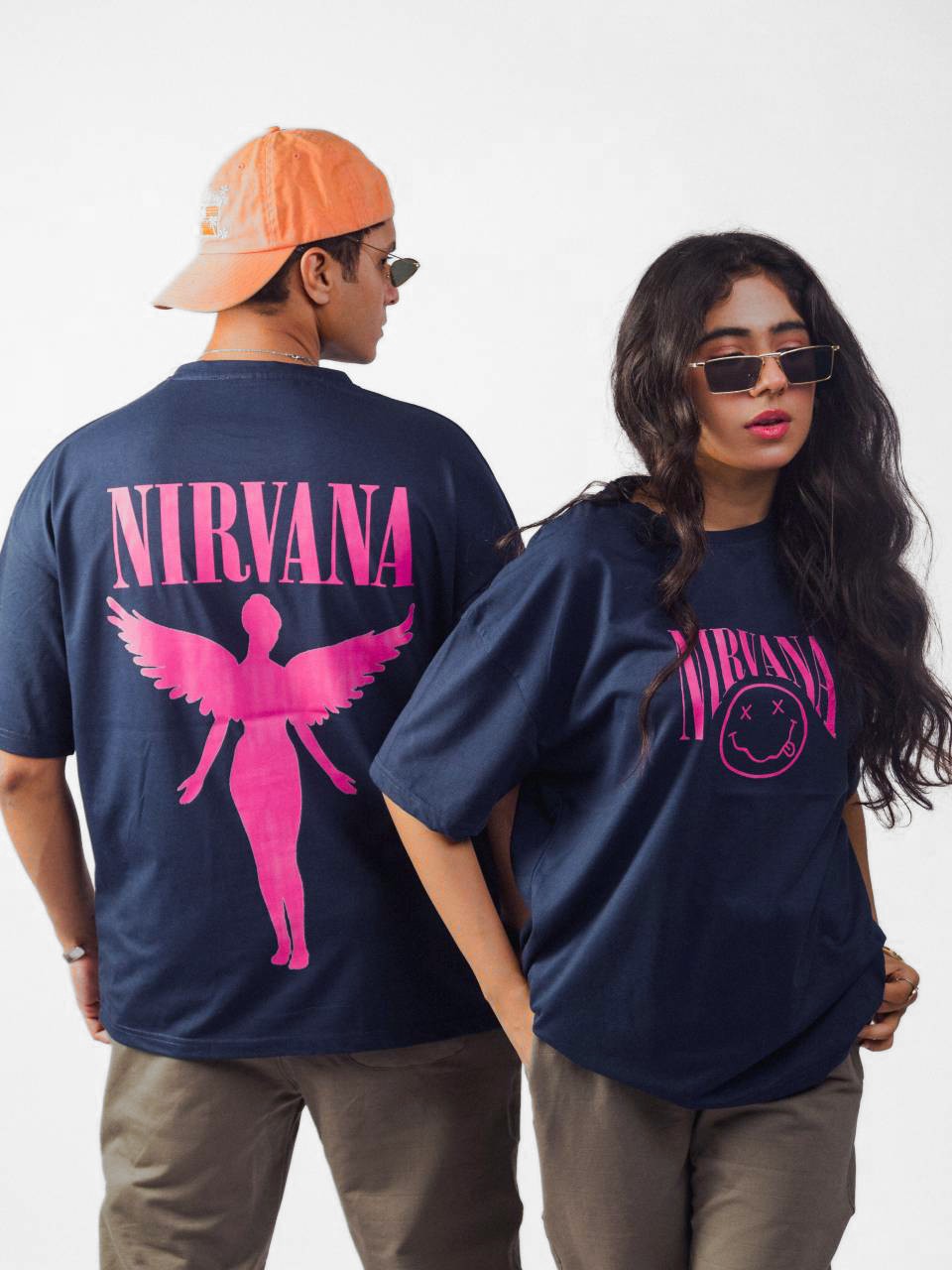 female and male model wearing blue nirvana oversized graphic t shirt showing the front and back side of the t shirt