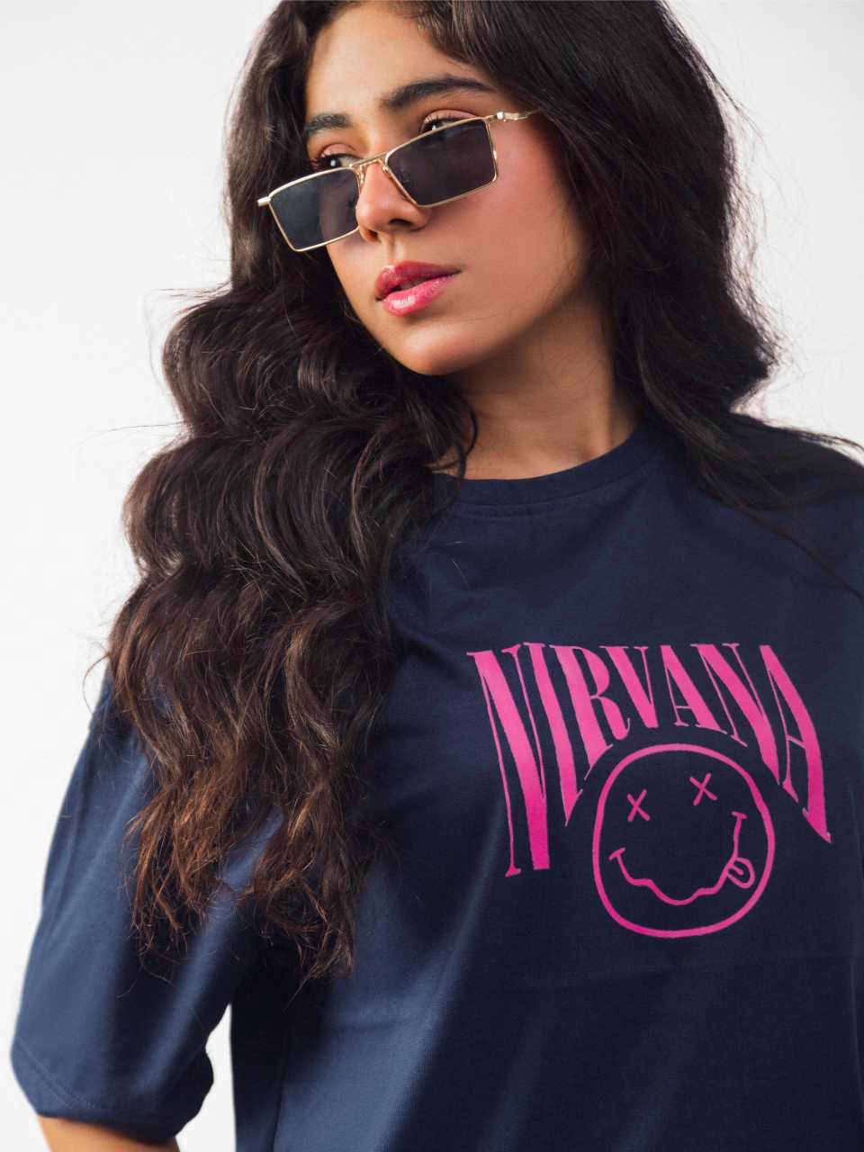 female model wearing blue nirvana oversized graphic t shirt showing the front side of the t shirt in a detailed view