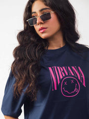 female model wearing blue nirvana oversized graphic t shirt showing the front side of the t shirt in a detailed view
