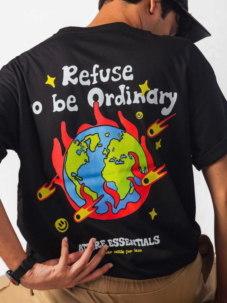male model wearing black refuse to be ordinary oversized graphic t shirt showing back in detailed view