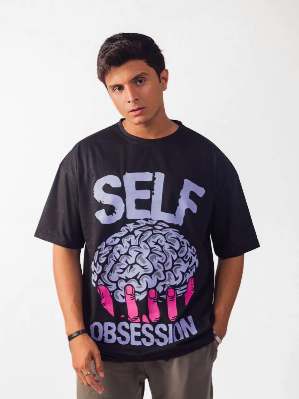 male model wearing black self obsession oversized graphic t shirt showing front side 