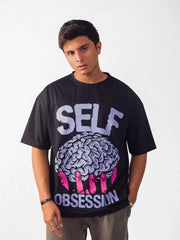 male model wearing black self obsession oversized graphic t shirt showing front side 