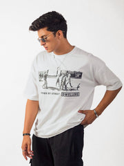 male model wearing white street dwellers oversized graphic t shirt showing the side view