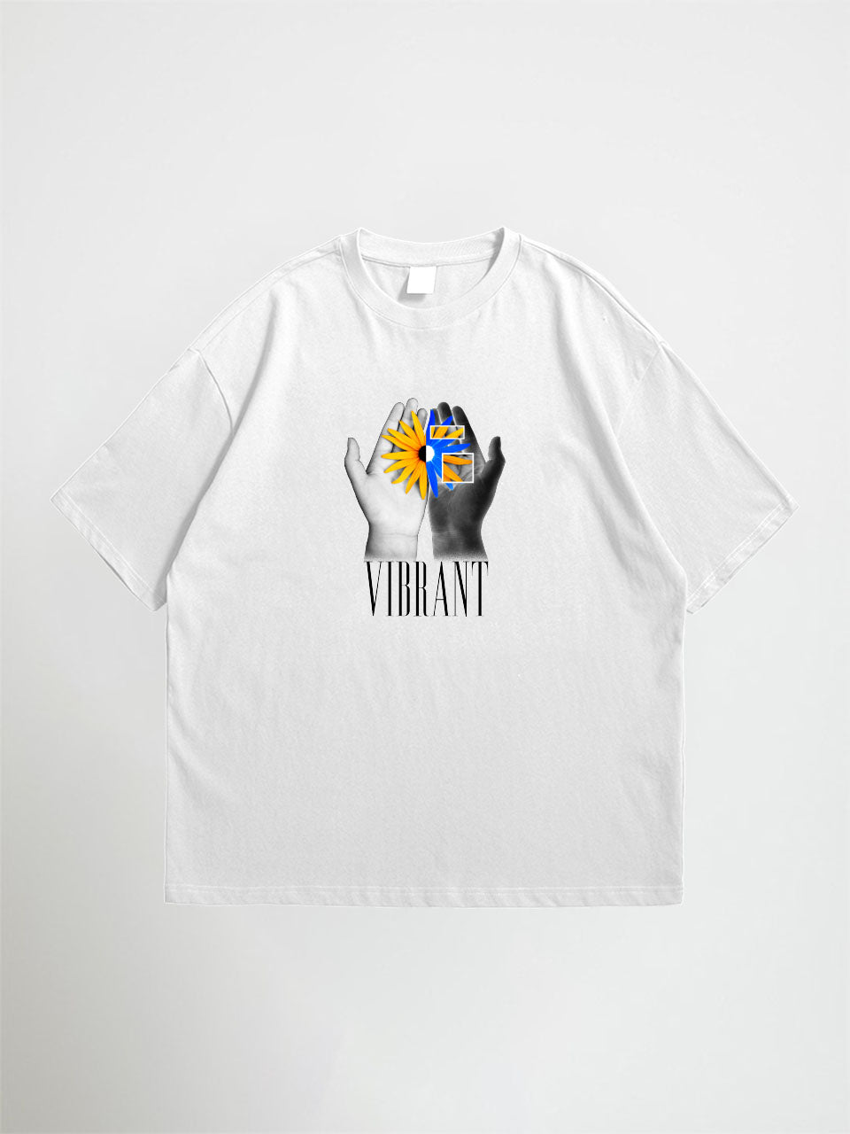 White vibrant oversized graphic t-shirt with a graphic design of hands holding a sun and the word 'Vibrant' on a white background