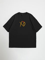 Black weeknd oversized graphic t-shirt with yellow 'XO' logo on a front of the t shirt