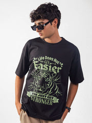 male model wearing black you just get stronger oversized graphic t shirt showing the front side while standing