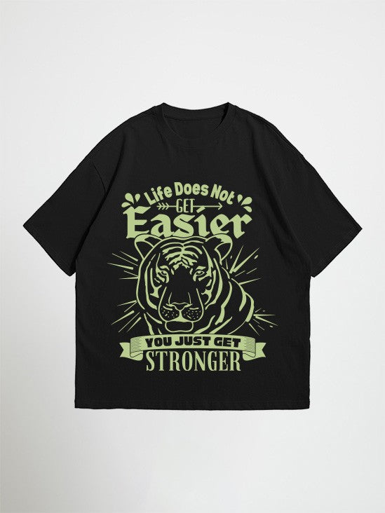 Black you just get stronger oversized graphic t-shirt with a tiger graphic and motivational quote on a white background